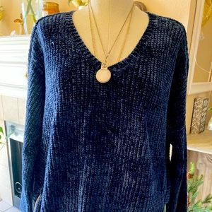 Chenille navy blue v neck sweater w zip one side other a vent.